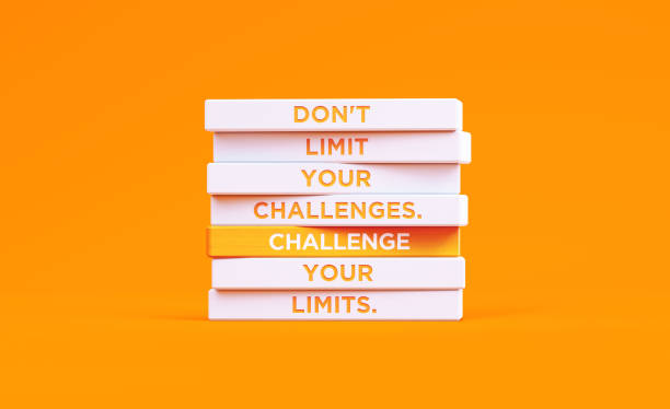 istock Don't Limit Your Challenges Written Wood Blocks On Orange Background - Motivation Concept 2186239560