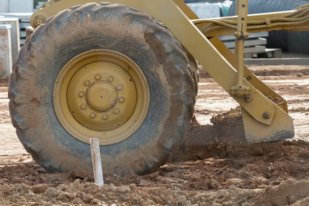 istock A large yellow tire with mud on it 2186243968