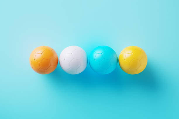 Colorful soccer balls on blue background. Horizontal composition.