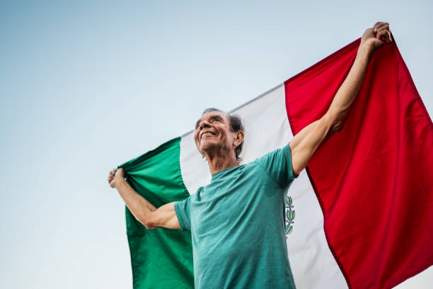 istock Senior man holding mexican flag 2186250510