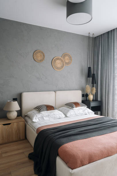 Cozy modern bedroom with neutral tones and stylish decor elements