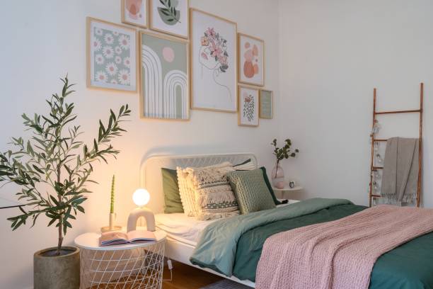 istock Cozy modern bedroom with artistic decor and calming colors in soft lighting 2186251871