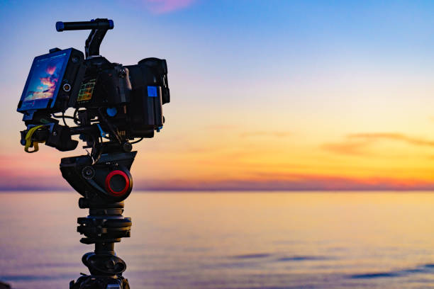 istock Camera taking picture of sunset over sea 2186253652