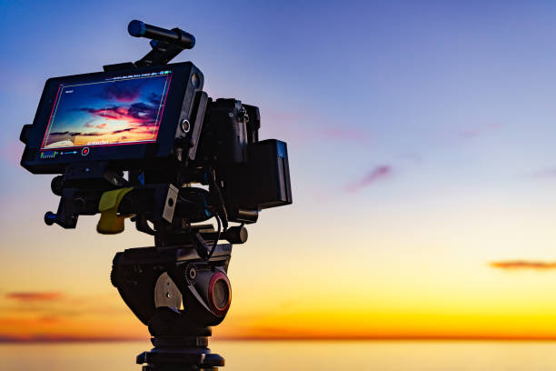 istock Camera taking picture of sunset over sea 2186254589