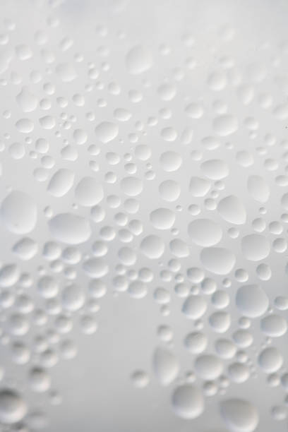 istock Water Condensation Small Bubbles Moisture on a Glass Window Close up 2186255447