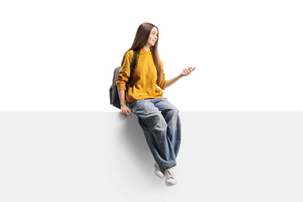 istock Teenage female student sitting on a panel and talking 2186257863