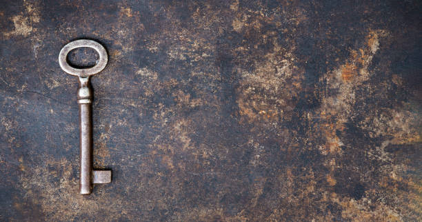 istock Vintage key on a rusty metal background, escape room game banner 2186263365