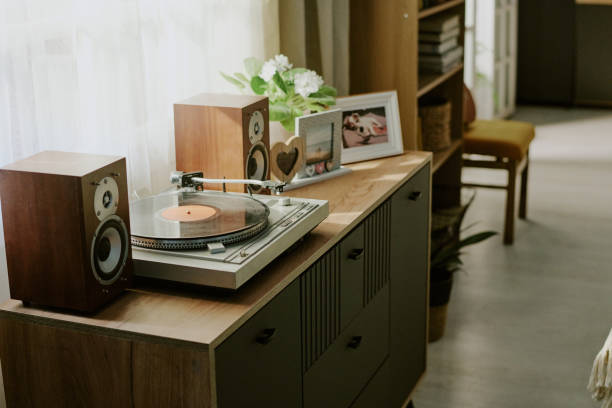 istock Playing Record on Vintage Turntable with Surrounding Decor 2186273737