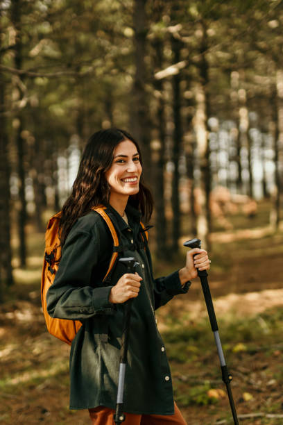 istock Walking alone through the sunny woodland 2186277654