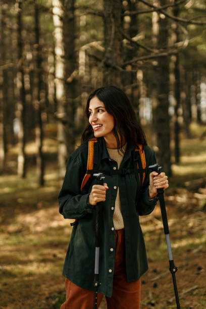 istock Walking alone through the sunny woodland 2186277659