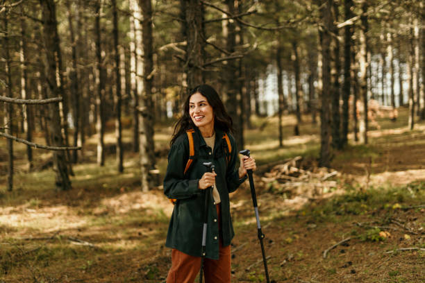 istock Walking alone through the sunny woodland 2186277701