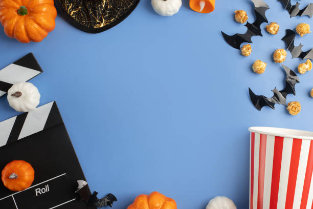 istock Halloween movie, popcorn and clapperboard, cinema ticket background, october celebration, production and fun entertainment. 2186281899