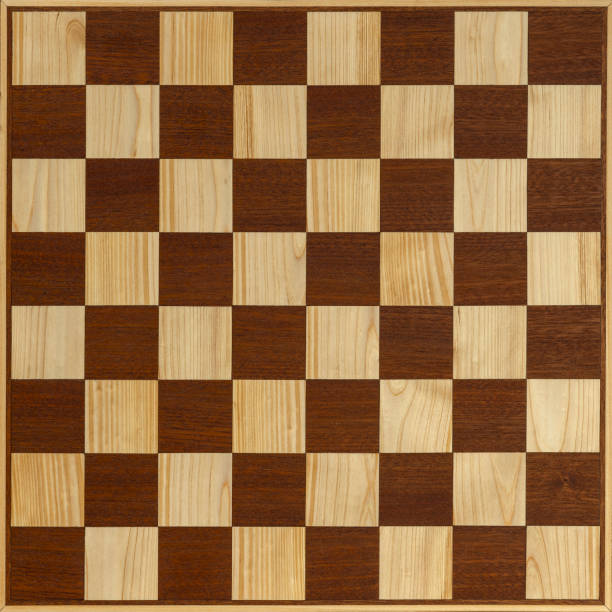 istock Empty wooden chessboard with alternating brown and beige squares 2186283067