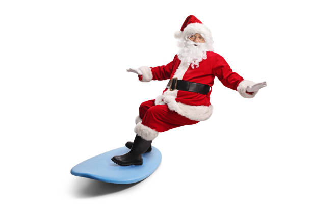 Santa claus riding a surfboard isolated on white background