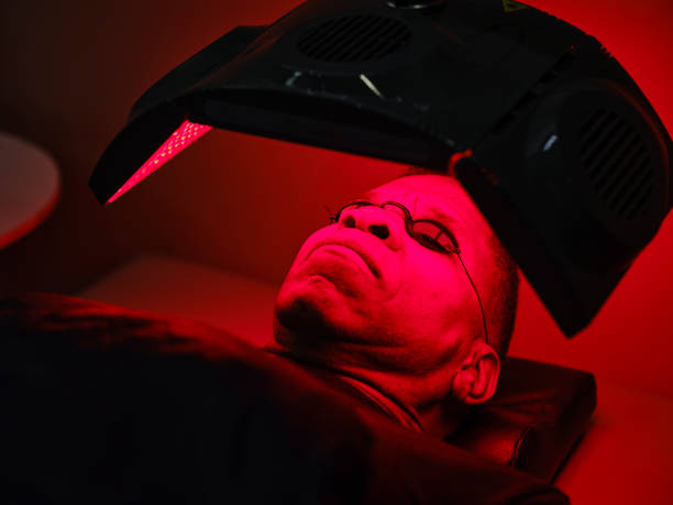 istock Man On an LED Bed Receiving Red Light Therapy 2186283549