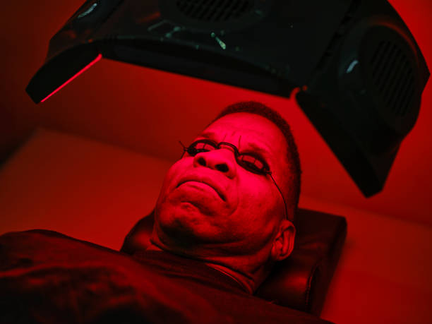 istock Man On an LED Bed Receiving Red Light Therapy 2186283680