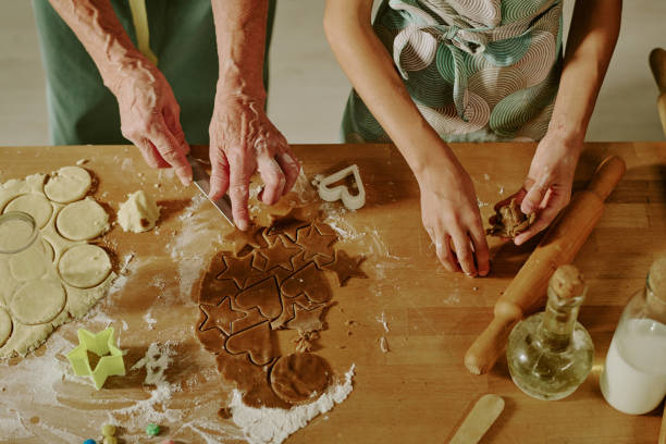 istock Elderly Woman Baking Cookies With Child in Kitchen 2186283709