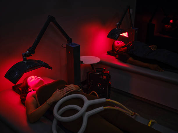 istock Two people on LED Beds Receiving Red Light Therapy 2186283799