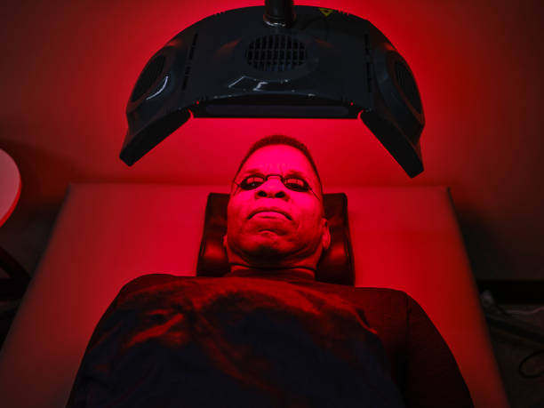 istock Man On an LED Bed Receiving Red Light Therapy 2186283901