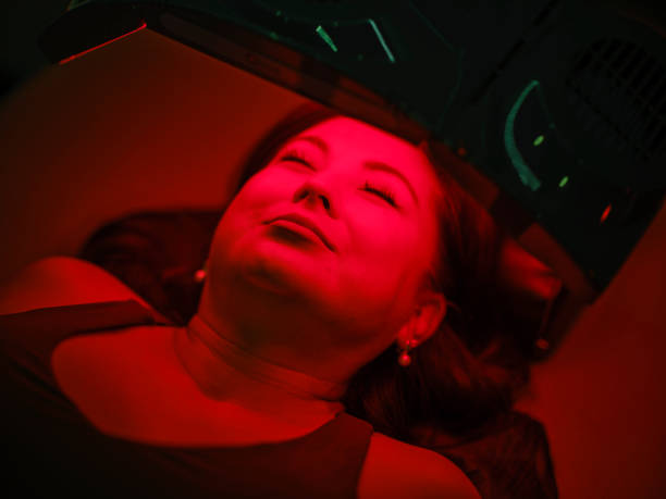 istock Woman On an LED Bed Receiving Red Light Therapy 2186283974