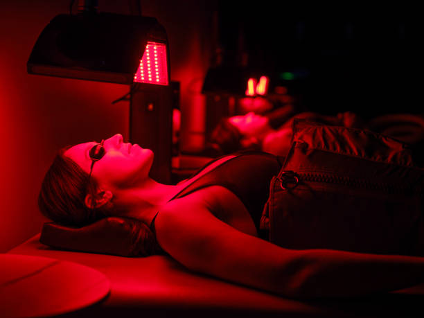 istock Group of People on  LED Beds Receiving Red Light Therapy 2186284304