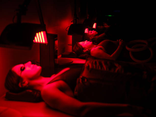 istock Group of People on  LED Beds Receiving Red Light Therapy 2186284344