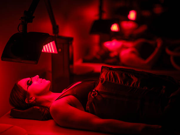 istock Group of People on  LED Beds Receiving Red Light Therapy 2186284463