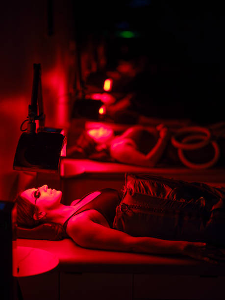 istock Group of People on  LED Beds Receiving Red Light Therapy 2186284608