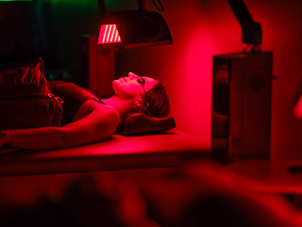 istock Woman On an LED Bed Receiving Red Light Therapy 2186284752