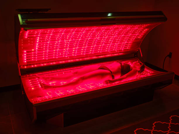 istock Woman On an LED Bed Receiving Red Light Therapy 2186284966