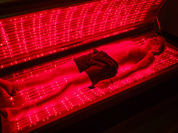 istock Young Man On an LED Bed Receiving Red Light Therapy 2186285276