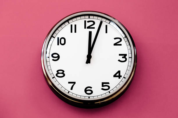 istock White Wall Clock On Fuchsia Background, stock photo 2186287103