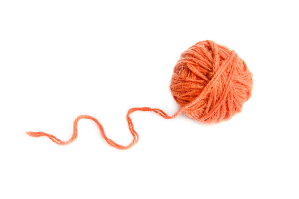 Ball of terracotta yarn isolated on white background.