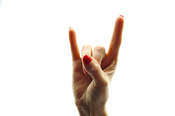 Six mixed hands are raised against white, each making the Devil's Horns or rock 'n Roll hand sign.
