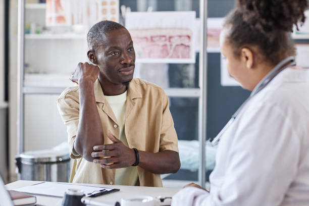 istock Man Visiting Dermatologist and Showing Skin Rash 2186297636