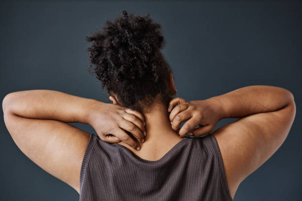 istock Black Woman Scratching Neck Back View 2186297794