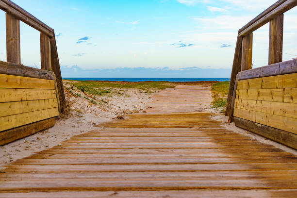 istock Beach with wooden path to sea water. 2186302918