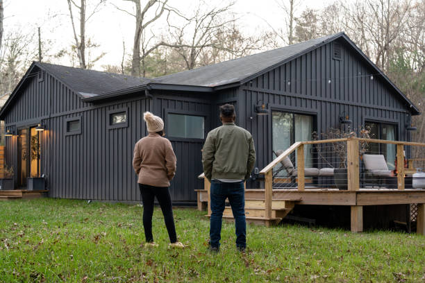 couple in front of the new house