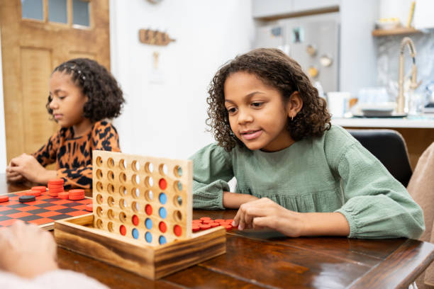 istock family playing game boards inside the house in the mountains 2186306879