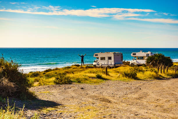 istock Tourist traveling by camper, camp on seashore, Spain 2186307208