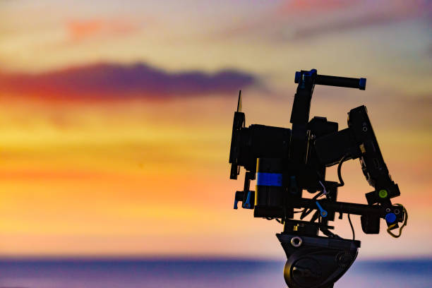 istock Camera taking picture of sunset over sea 2186312949