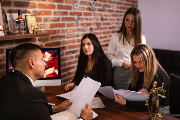 istock Lawyer Discussing Case with Clients at the Office 2186315244
