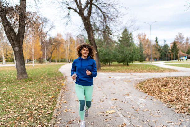 istock Young female athlete jogging outdoors 2186315575
