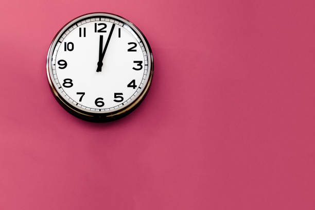 istock White Wall Clock On Fuchsia Background, stock photo 2186327091