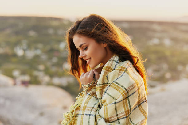 istock Red-haired woman with fred on nature in the mountains smiling model side view 2186332105