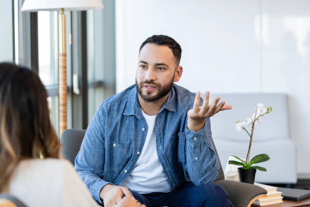istock Man talks with attentive and caring female therapist 2186332795