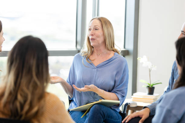 istock Mature counselor facilitates support group 2186332815