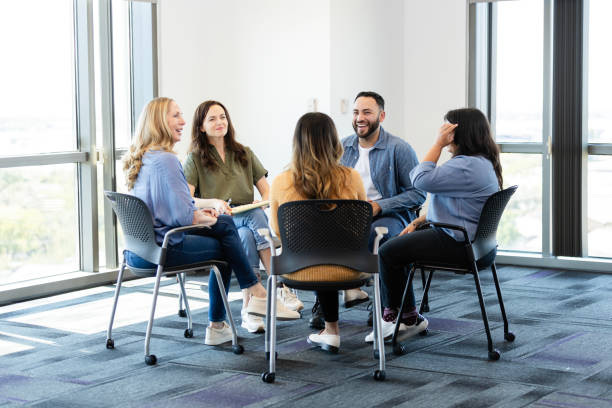 istock Cheerful man shares during group therapy session 2186332824