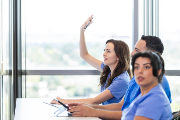 Questioning Medical 80+ Attentive Medical Student Asks Question During Class fotos de stock ...