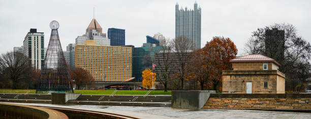 Pittsburgh Downtown Skyline Winter Landscape with Christmas Light Tower at Point State Park in Pennsylvania, USA: The Metropolitan Beauty of the City of Bridges at the Golden Triangle of Three Rivers
